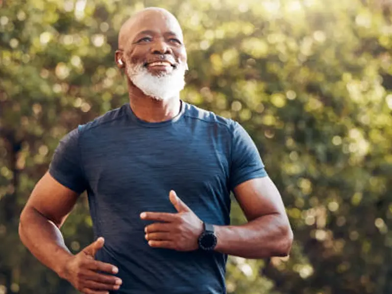 Fit older man running outdoors